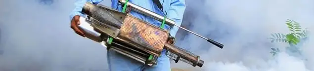 Fumigation technician using a fogger for deep pest treatment in Knoxville, TN